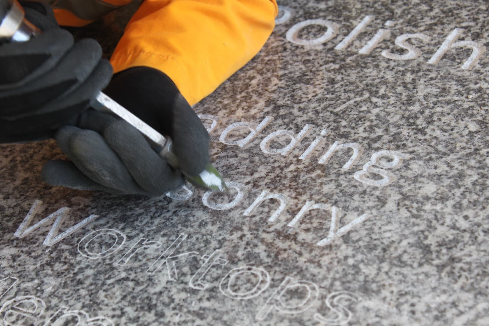 Mason hand-lettering into polished De Lank Cornish granite