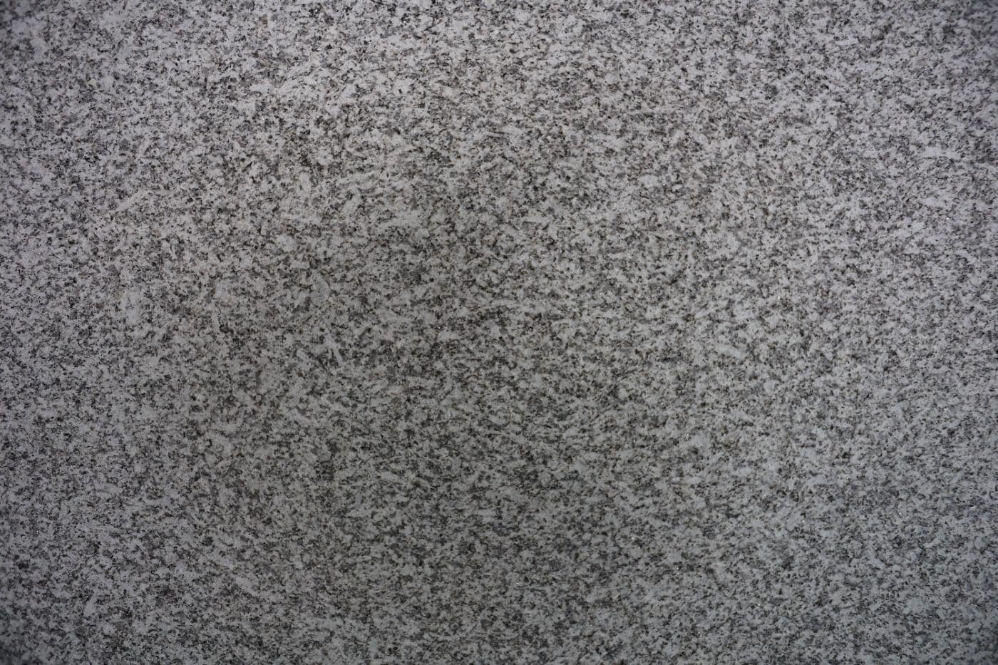 De Lank Cornish granite sawn finish — Diamond wire and blade-sawn surfaces retain visible saw marks — a contemporary,